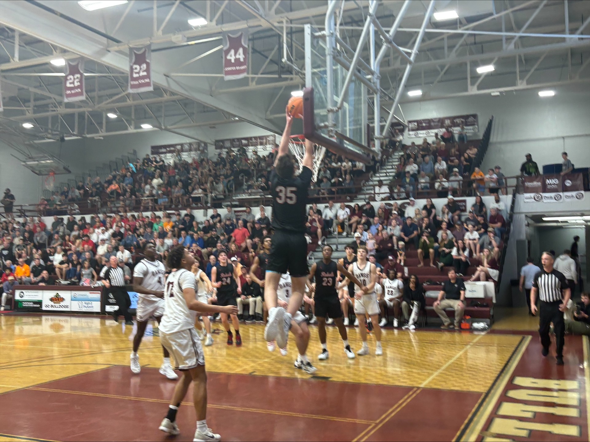 Maryville's Luke Sigmund (35) skies for an alley-oop during the first quarter. Photo by Brian Hamilton